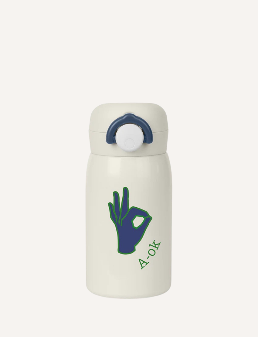 The Fabelab Water Bottle features a stainless steel design ideal for kids, with a dark blue lid. It showcases a playful OK hand gesture and "A-OK" in green, complete with a spill-proof spout for easy, mess-free sips.