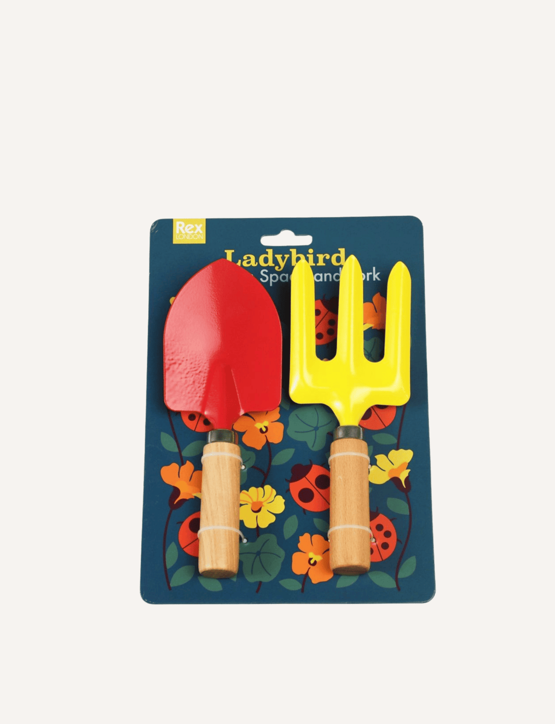 A small Ladybird Garden Fork with a yellow head and a wooden handle lies next to a red Ladybird Garden Spade, both featuring matching wooden handles. These vibrant tools are part of Rex London's charming kids gardening set, arranged against a plain white background—perfect for young gardeners.