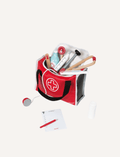 The Janod Little Doctor Suitcase, featuring a red and white design with a black handle, comes with various wooden accessories including a thermometer, syringe, reflex hammer, otoscope, stethoscope, bandage, bottle, tongue depressor, and notepad with a pencil—perfect for any roleplay game.