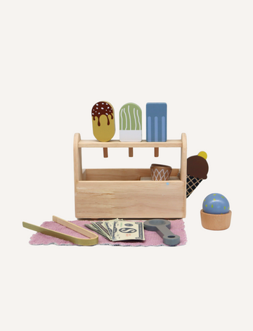 The Play Way's Ice Cream Parlour with Menu is a delightful wooden toy set that features a wooden stand with vibrant ice cream popsicles, pretend money, tongs, scoops, and an ice cream cone on a pink mat. Ideal for imaginative play, this setup perfectly mimics a small ice cream shop counter.