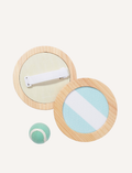 The Catch Ball Set - Rio Sun Multi by Sunnylife includes two round wooden paddles adorned with blue and lavender stripes, elegantly set against a light backdrop. A small green and white tennis ball floats above, inviting play.