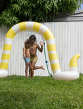 Experience backyard fun with the Giant Sunnylife Snake Sprinkler and Pump by The Play Way. This inflatable pool float is designed as a yellow and white striped snake, complete with exaggerated eyes and a playful tongue. Made from durable PVC, it ensures stability with two supporting circular float bases—an ideal companion for your summer adventures.