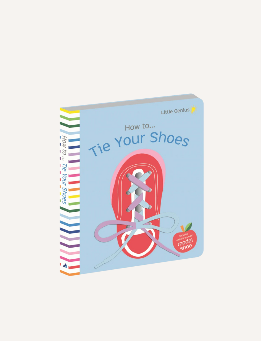 A colorful children's book titled "Little Genius Vol. 2 - How to Tie Your Shoes Book" from Lake Press. The cover features a drawing of a red shoe with white laces tied in a bow. With interactive learning, each page has striped edges in various colors. An illustration of an apple says "Model Shoe.