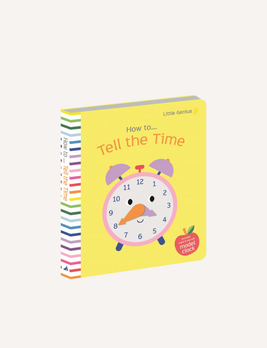 Children's book titled "Little Genius Vol. 2 - How to Tell the Time Book" by Lake Press. The cover features a colorful illustration of a smiling clock with eyes, a nose, and hands on a yellow background. With interactive learning elements, the spine contains a rainbow of colors and various text.