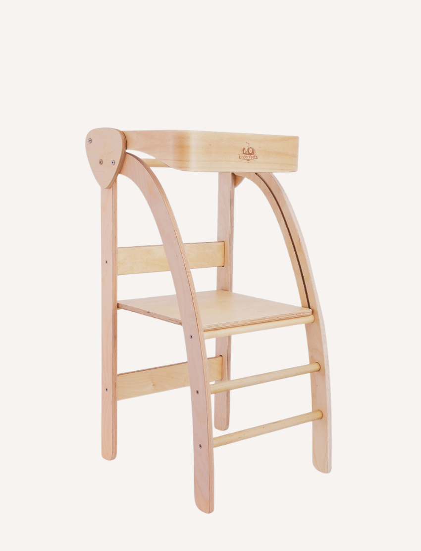 The Pikler Observation Tower by Artiwood is displayed in a folded position. This wooden climbing arch features a natural finish, curved sides, and multiple horizontal rungs for climbing. The sturdy structure makes it ideal for children's play.