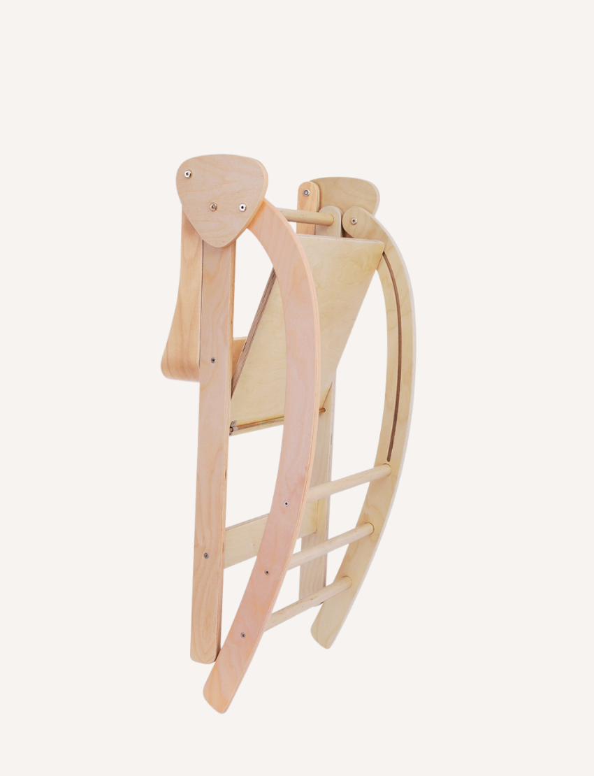 The Pikler Observation Tower by Artiwood is displayed in a folded position. This wooden climbing arch features a natural finish, curved sides, and multiple horizontal rungs for climbing. The sturdy structure makes it ideal for children's play.