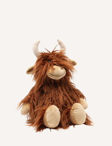 Henry The Highland Cow, by Nana Hutchy, is a soft toy that looks like a shaggy brown highland cow with long hair, beige hooves, horns, and a smiling face. This children's soft toy sits upright against a plain white background and is perfect for cuddles and play.