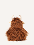 Henry The Highland Cow, by Nana Hutchy, is a soft toy that looks like a shaggy brown highland cow with long hair, beige hooves, horns, and a smiling face. This children's soft toy sits upright against a plain white background and is perfect for cuddles and play.