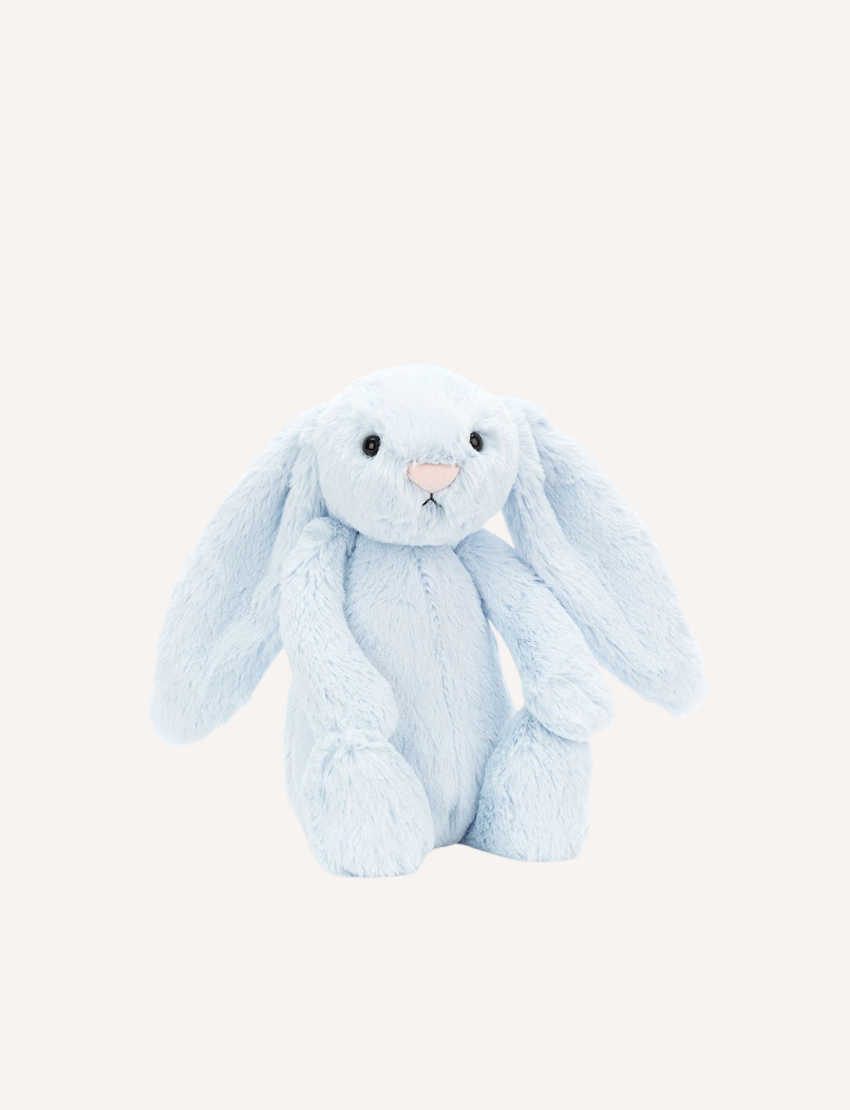 Introducing the Bashful Bunny by Jellycat, a charming plush toy shaped like a beige rabbit with long, floppy ears. This endearing bunny features a pink nose and inner ears, along with a content expression on its face. Made with Jellycat's signature soft fur, Bashful Bunny is posed sitting upright against a plain white background—making it the perfect gift!