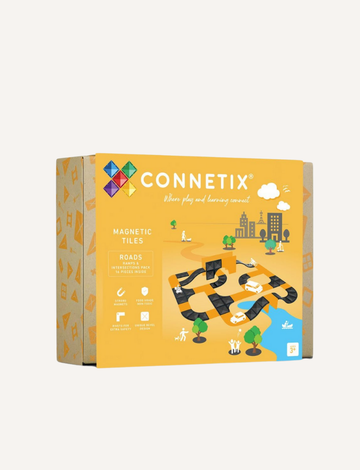 A yellow box of Connetix Ramps & Intersections Pack 16-Piece by Connetix Tiles. The packaging showcases illustrations of road tiles and cityscape elements, complete with trees and cloud graphics. Suitable for ages 3 and up.