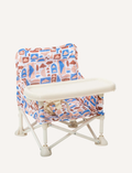 A pink and white checkered portable IZIMINI Baby Chair with a tray is set against a plain background. The lightweight, collapsible frame ensures easy transportation, making the high-chair adaptable for any outing or mealtime adventure.