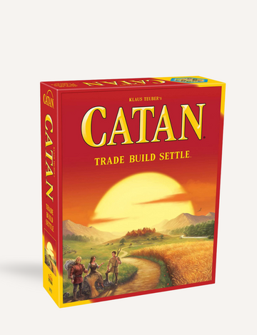 A game setup of Catan Trade Build Settle by VR Distribution includes hexagonal tiles that represent different resources, various cards, dice, small wooden pieces, and player mats arranged for gameplay.