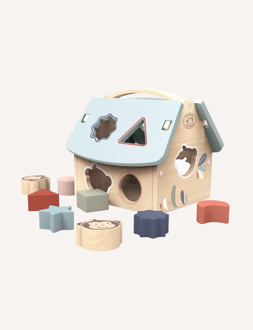 Wooden house shape sorter toy with colorful blocks, showcasing different animal and leaf designs.