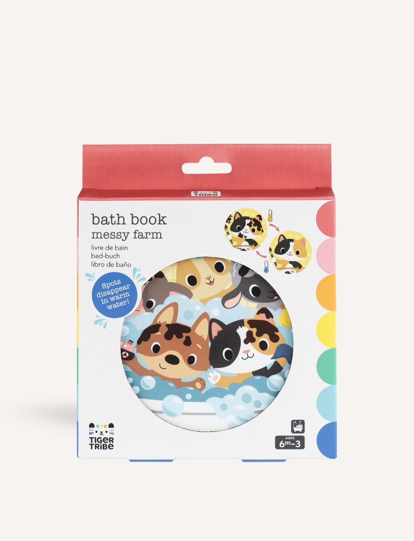 The "Bath Book - Messy Farm" from Tiger Tribe is a colorful children's bath book packaged in a vibrant, circular box. The cover features illustrated farm animals peeking out of a bubble bath and is suitable for ages 6 months to 3 years.