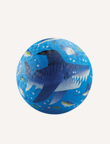 The Crocodile Creek 7 Inch Playground Ball - Shark Reef features a shark with small fish on a white background. Its blue rubber texture enhances grip, perfect for active play, and promotes gross motor skills in children.