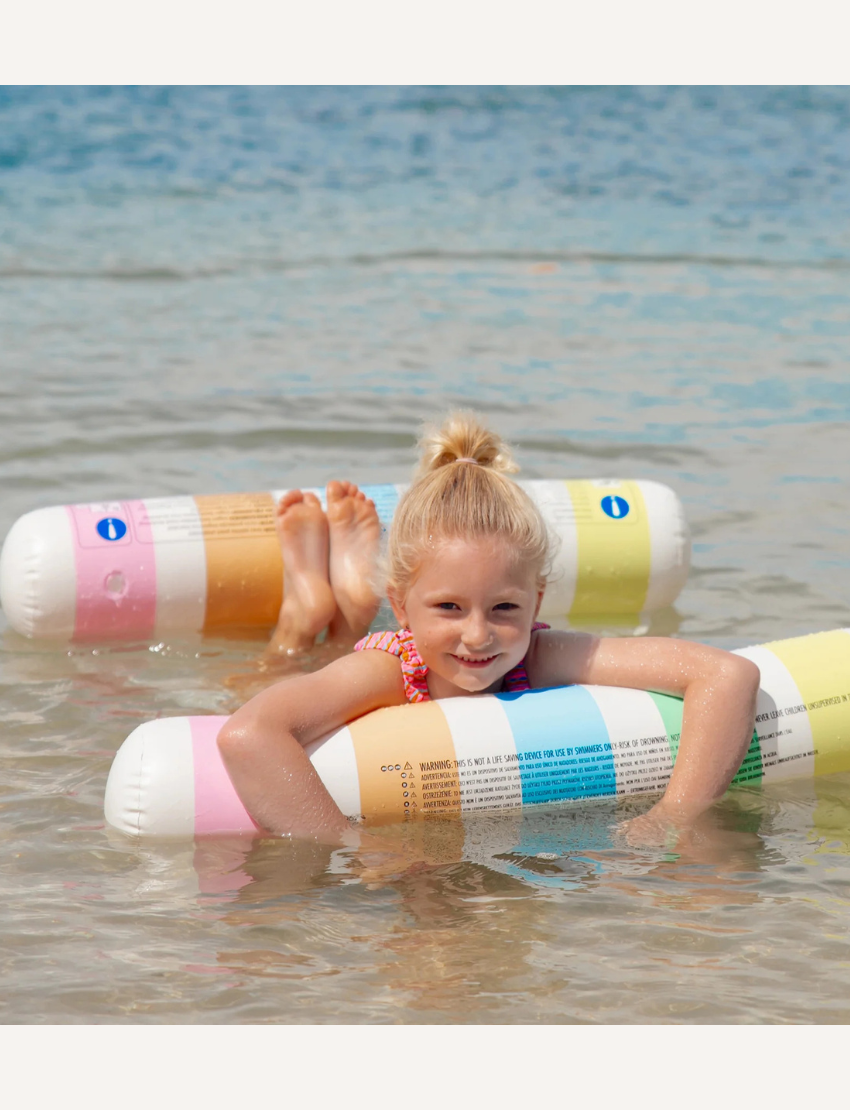 The Sunnylife Hammock Float, a green and white striped inflatable lounger with PVC durability, includes two cylindrical pillows and doubles as a mesh hammock for ultimate relaxation by the pool. Set against a plain white background, it's your ideal companion for unwinding in style.