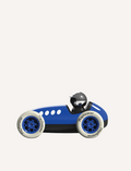 An illustration depicts a person in a blue, vintage-style race car wearing a black helmet. The UK-designed Verve Loretino Monaco by Playforever features large white tires branded with 