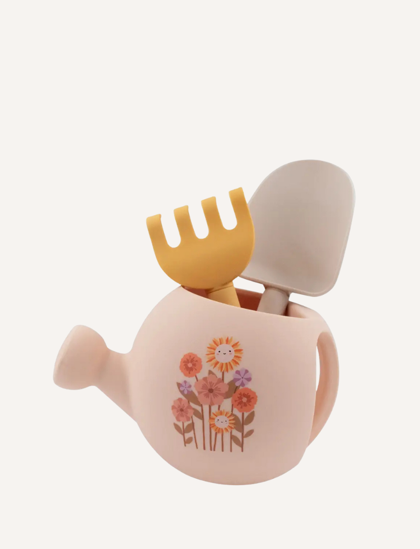 The Playground "My First Gardening Set" includes a blue silicone watering can with a yellow tractor, a green recycled rake, and a yellow spade for an ideal gardening experience.