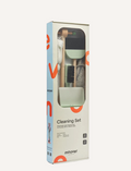 Introducing the Essentials Cleaning Set - Green by Moover, featuring a light wooden stand and a comprehensive set including a mop with white bristles, a brush with black bristles, a dustpan, a gray cloth, and a holder accented in green.