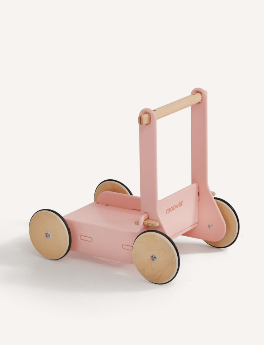 The Moover Toys Classic Baby Walker, in light green, is a perfect wooden mobility toy for a child's development. Featuring four natural wood wheels and a sturdy handle, its elegant brand name enhances its simple design, promising both fun and growth for your little one.