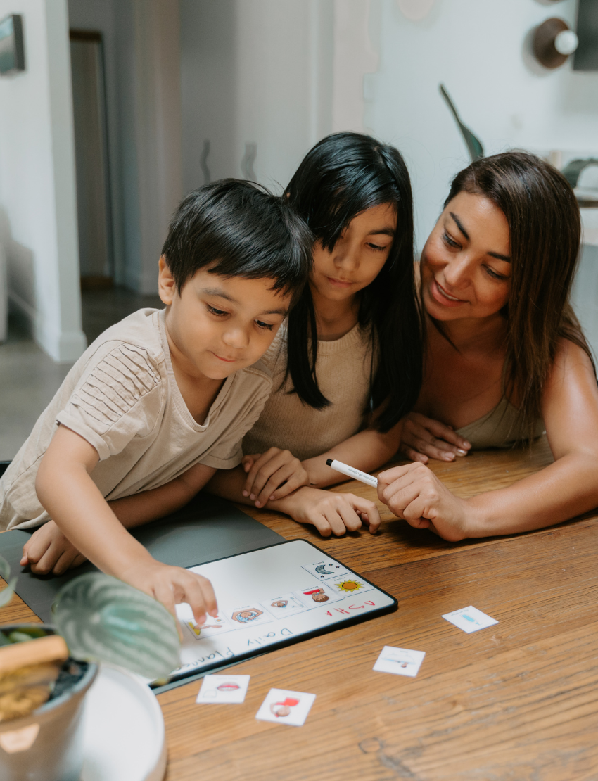 Image features Kinder Routine Magnets by Sensory Play Australia: two laminated sheets with colorful icons and words like "Outside," "Lunch," and "Story time." Two small classroom magnet cards enhance the structured learning atmosphere, fostering student engagement.