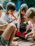 A person holds a Sensory Play Australia card from the 