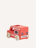 The Moover Mini Emergency Cars are simple wooden ambulances with white wheels, a red cross on the side, and 