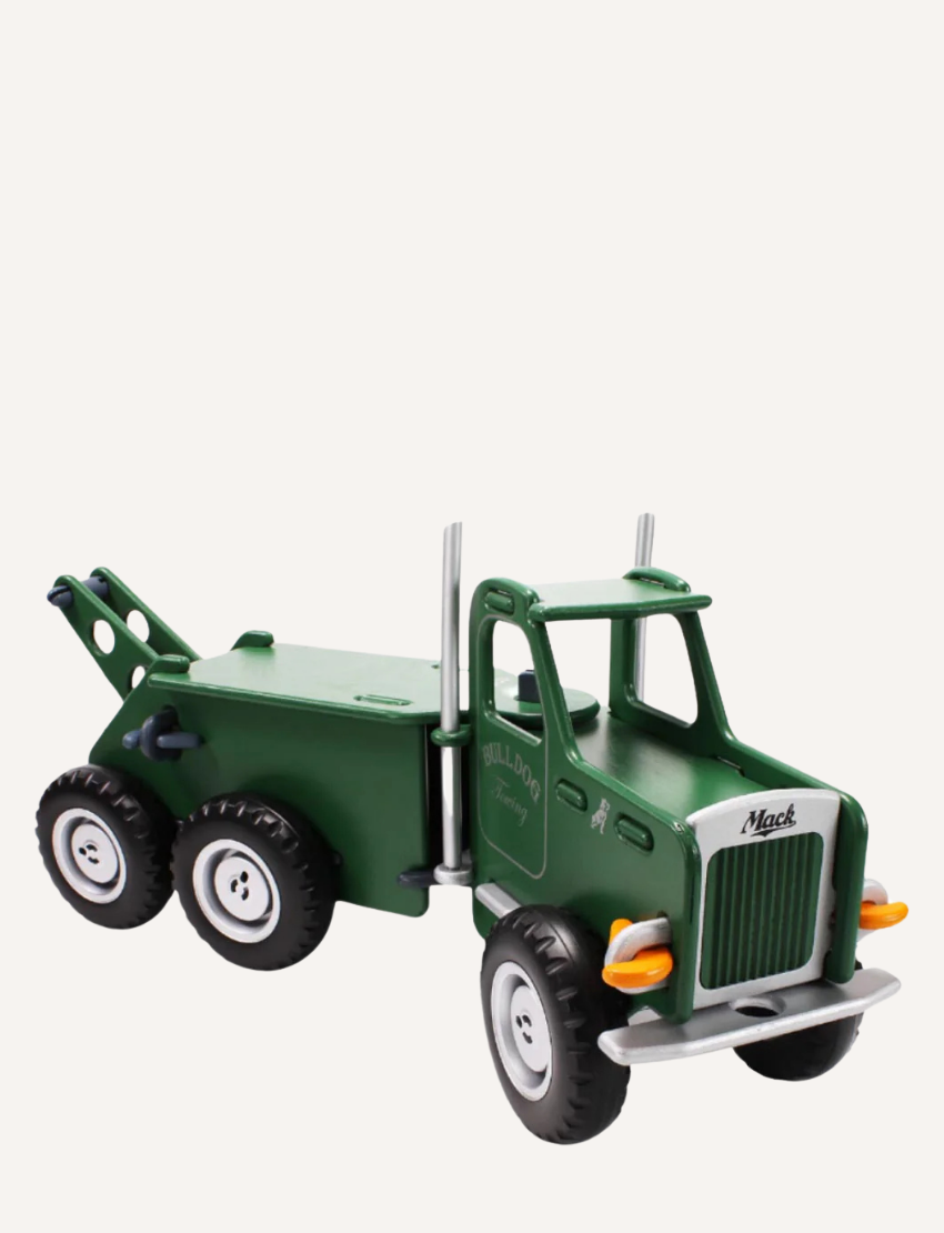 The Moover Mack Ride On Truck is a green toy tow truck with six wheels, featuring a detachable crane. It includes white accents on the wheels, headlights, and grill. "MACK" is boldly displayed on the side door, all set against a plain white background.