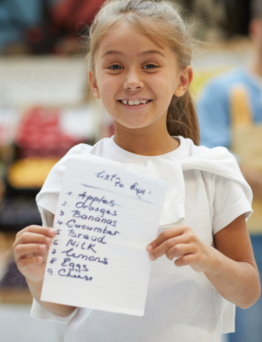 The Therapy At Home Handwriting in Practice Program includes a green and blue box with notebooks, pens, sticky notes, stickers, a pencil sharpener, planner sheets, a black carrying case, and a handwriting workbook for effective practice.
