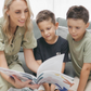 The Therapy At Home Handwriting in Practice Program includes a green and blue box with notebooks, pens, sticky notes, stickers, a pencil sharpener, planner sheets, a black carrying case, and a handwriting workbook for effective practice.