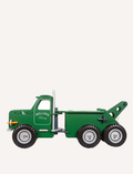 The Moover Mack Ride On Truck is a green toy tow truck with six wheels, featuring a detachable crane. It includes white accents on the wheels, headlights, and grill. 