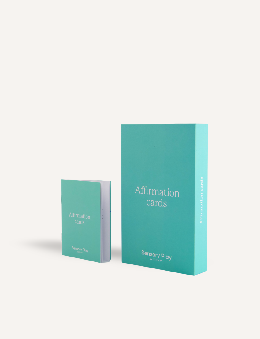 Sensory Play Australia Affirmation Cards in a turquoise box with a smaller open booklet, offering support for children's emotional developmental skills.