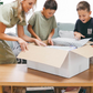The Therapy At Home Handwriting in Practice Program includes a green and blue box with notebooks, pens, sticky notes, stickers, a pencil sharpener, planner sheets, a black carrying case, and a handwriting workbook for effective practice.