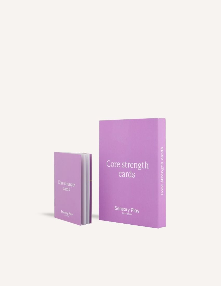 Two stacks of the purple "Core Strength Card Set" from Sensory Play Australia are displayed. One stack is slightly shorter, both showcasing a minimalist design on a plain gray background.