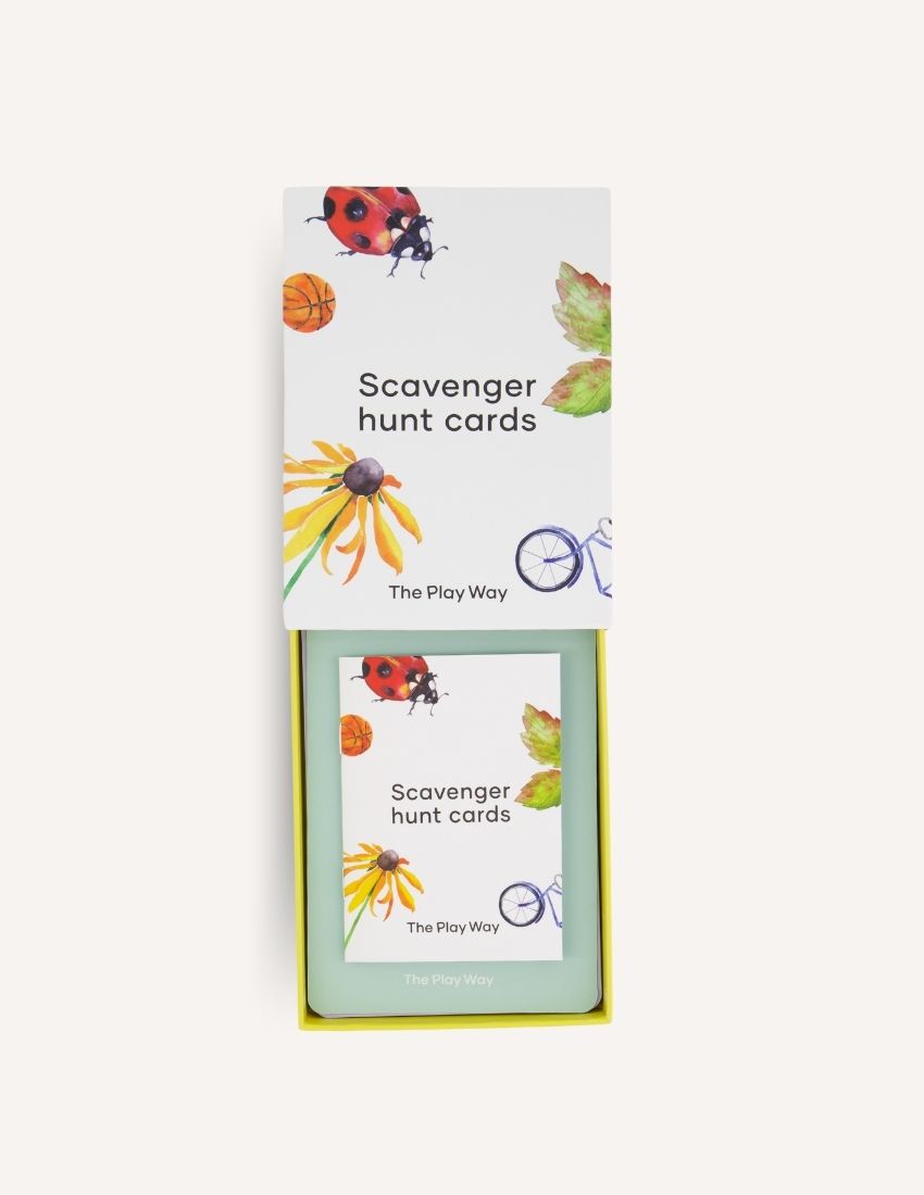 Two cards from the "Scavenger Hunt Cards Set in Box (SPA)" by Sensory Play Australia. The front card displays drawings of a flower, leaf, basketball, and bicycle wheel. The back card is partially visible, showing instructions and icons in various colors designed to promote gross motor skills and physical activity.