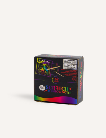 A box labeled "Scratch Rainbow Notes" by Jar Melo features an image of a vibrant scratch art owl. The packaging includes a warning about small parts, suggesting it is suitable for ages 3 and up, and the bottom showcases a colorful rainbow gradient design.