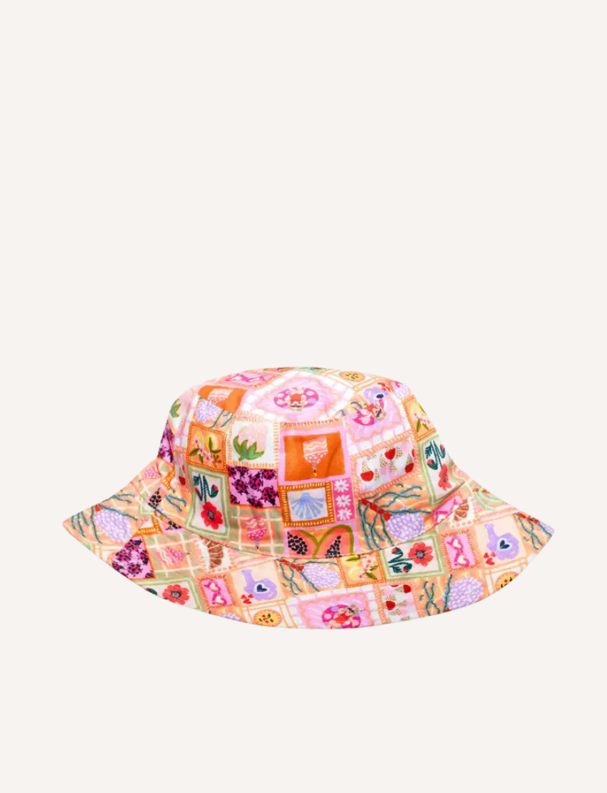 The IZIMINI Cotton Baby Hat is a vibrant bucket hat with a floral print of pink, orange, blue, and green leaves on white. Perfect for outdoor adventures with its wide brim and rounded top, it offers stylish sun protection.