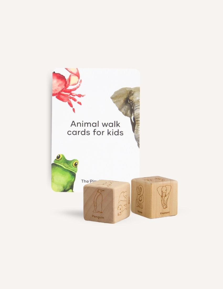 The "Animal Walk Card and Dice Set" by Sensory Play Australia provides a creative physical activity with illustrated cards showcasing animals such as a crab, elephant, and frog. The set includes two wooden dice featuring animal illustrations labeled "Penguin" and "Elephant," designed to help children develop their gross motor skills.