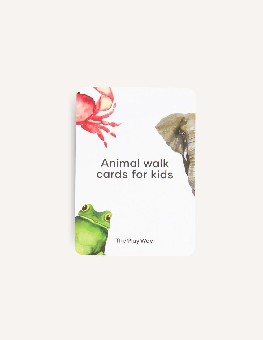 The "Animal Walk Card and Dice set" from Sensory Play Australia includes cards featuring illustrations of a frog, a crab, and an elephant, as well as two wooden dice. Each face of the dice displays engravings of different animals, such as a penguin and an elephant, encouraging imaginative physical activity for kids.