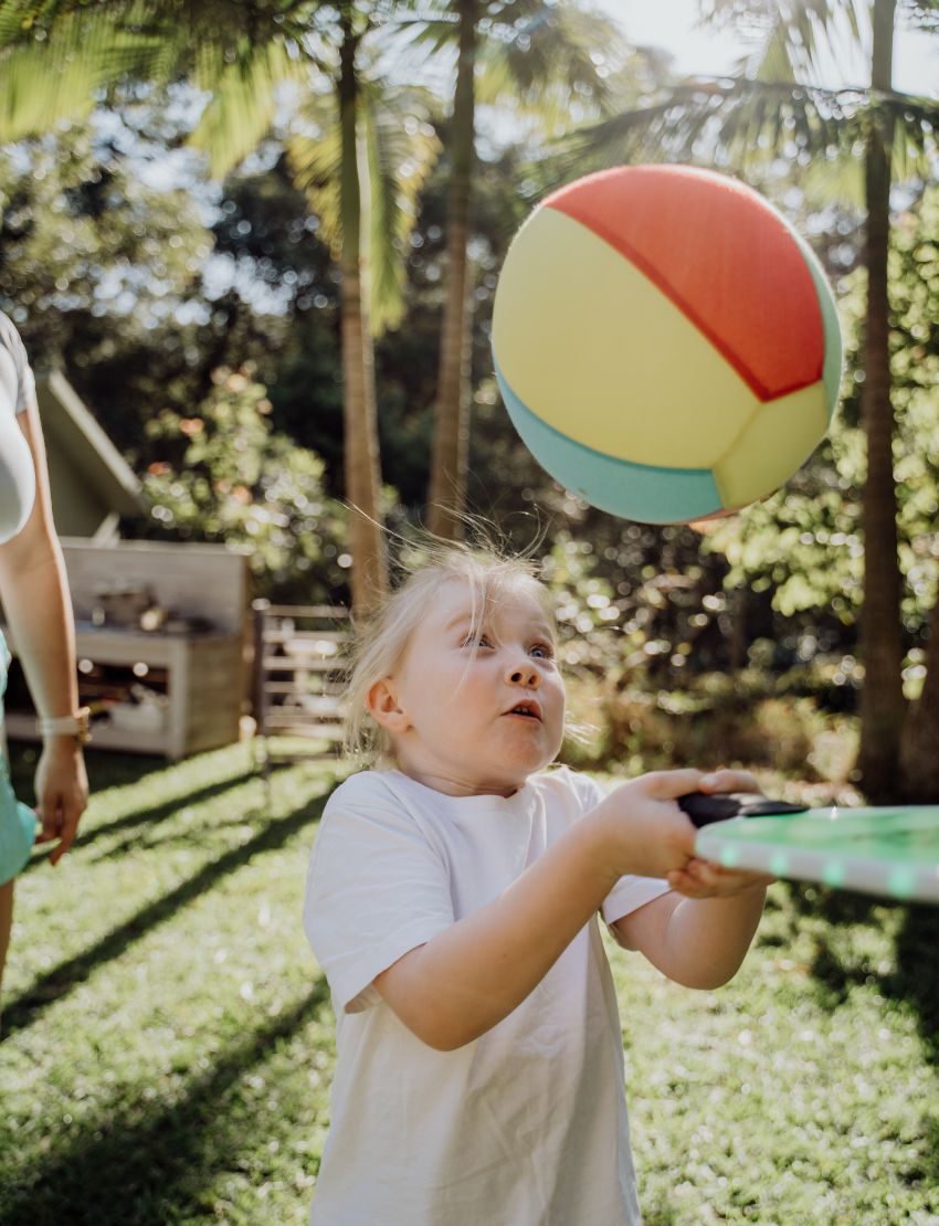 A set of colorful balloon covers by Sensory Play Australia, featuring an inflated beach ball, several deflated balloons in various colors, and a cardboard box labeled "Balloon Covers" with balloon illustrations.