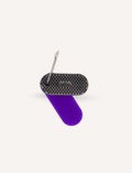 The Kaiko Regulation Fidgets Bundle by The Play Way comes in a black zippered carrying case that opens to reveal various items inside, including a purple silicone fidget, a metallic tool, a keychain, and other small accessories. Ideal for sensory regulation, the interior features a black velvety lining and mesh compartments for organization.