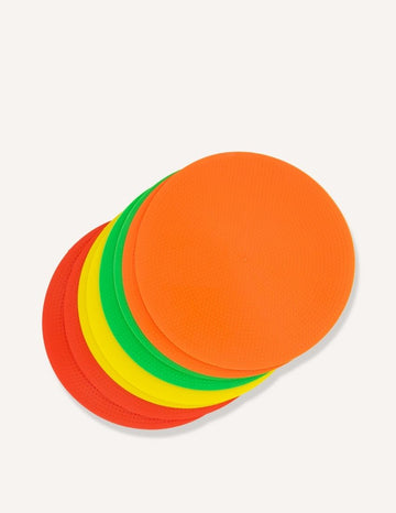 A stack of The Play Way Spot Markers in various colors, including red, yellow, green, and orange, arranged in a slightly fanned-out manner on a plain background.