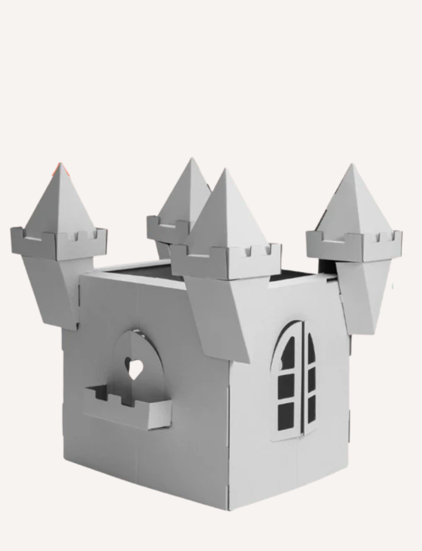 Introducing the Princess Castle by Les Petite Artistes: a charming cardboard play structure featuring four pointed turrets and a small heart-shaped window. This light gray castle is complete with an elegant arched window, perfect for imaginative play.