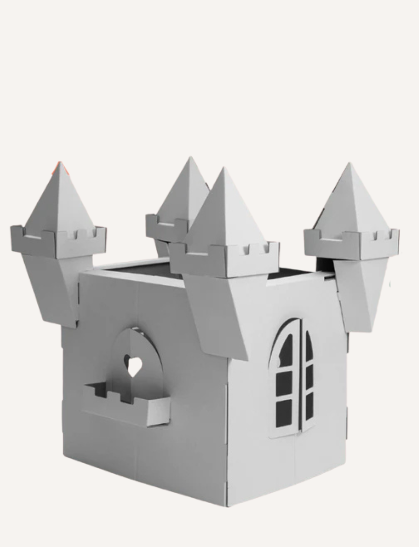 An unpainted, white cardboard castle playhouse kit, featuring turrets and archways. Perfect for creative DIY decoration.