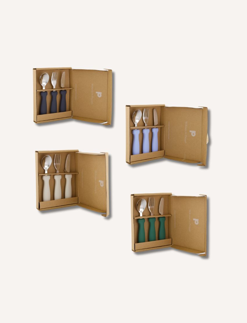 Collage of four kids cutlery sets in dark grey, pale blue, white, and green colors in packaging.