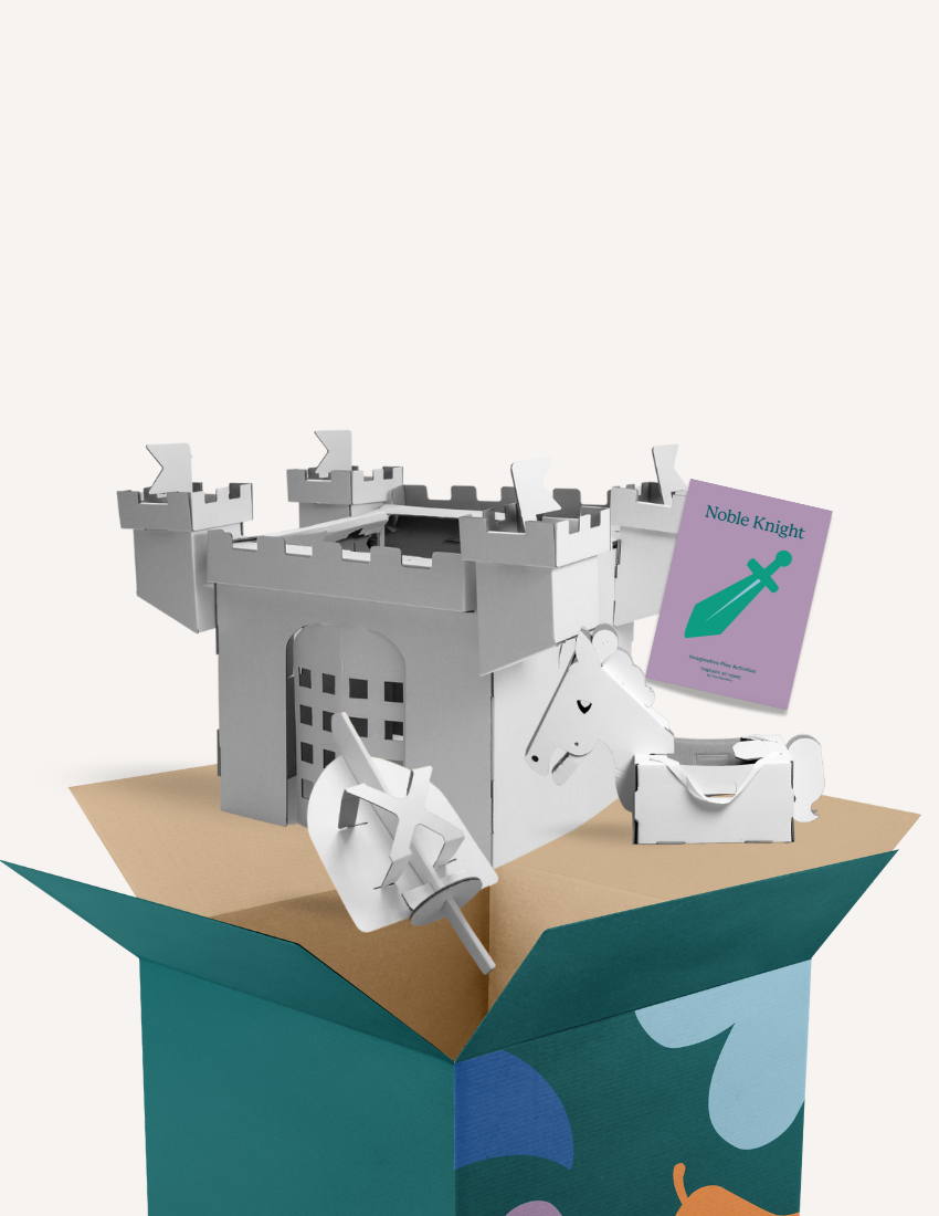 An open cardboard box reveals cardboard cutouts of a castle, a unicorn, a treasure chest, and a sword. A purple booklet titled "Noble Knight Kit" from The Play Way is visible, perfect for imaginative play and fostering cognitive development.