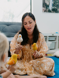 The Five Little Ducks Finger Puppet Set by Sensory Play Australia features six colorful felt duck puppets, numbered 2-7 with orange beaks, surrounding a gray card with a white duck illustration—ideal for engaging children's learning.