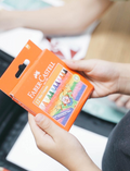 The Creative Handwriting Program by Therapy At Home includes an art pad, two pencils, a black case, crayons, and abstract booklets—ideal for supporting letter formation and fine motor skills.