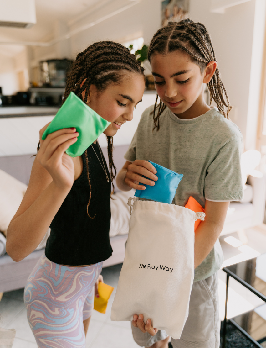 A white box with colorful geometric shapes has "Bean Bags" and "Sensory Play Australia" on the front. Ideal for motor skills and sensory regulation, it offers more than just fun—it's a developmental journey.