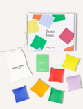 A white box with colorful geometric shapes has 